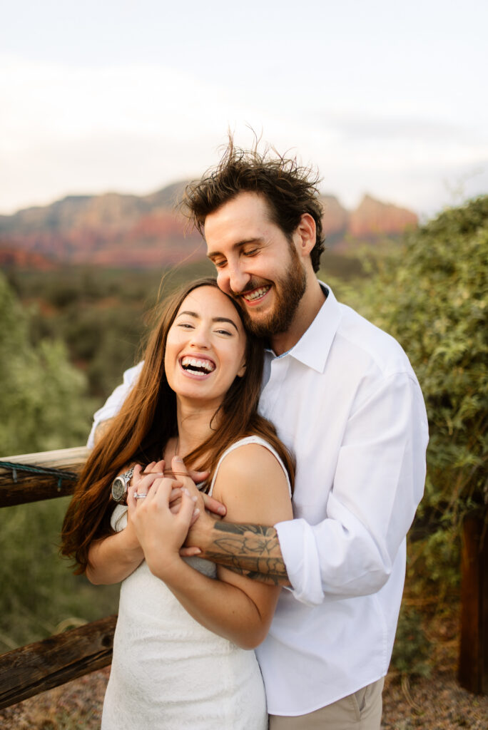 Bride and groom laughing together during Sedona elopement portraits